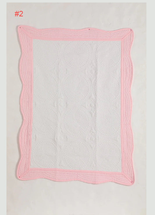 Heirloom baby quilt trimmed in pink