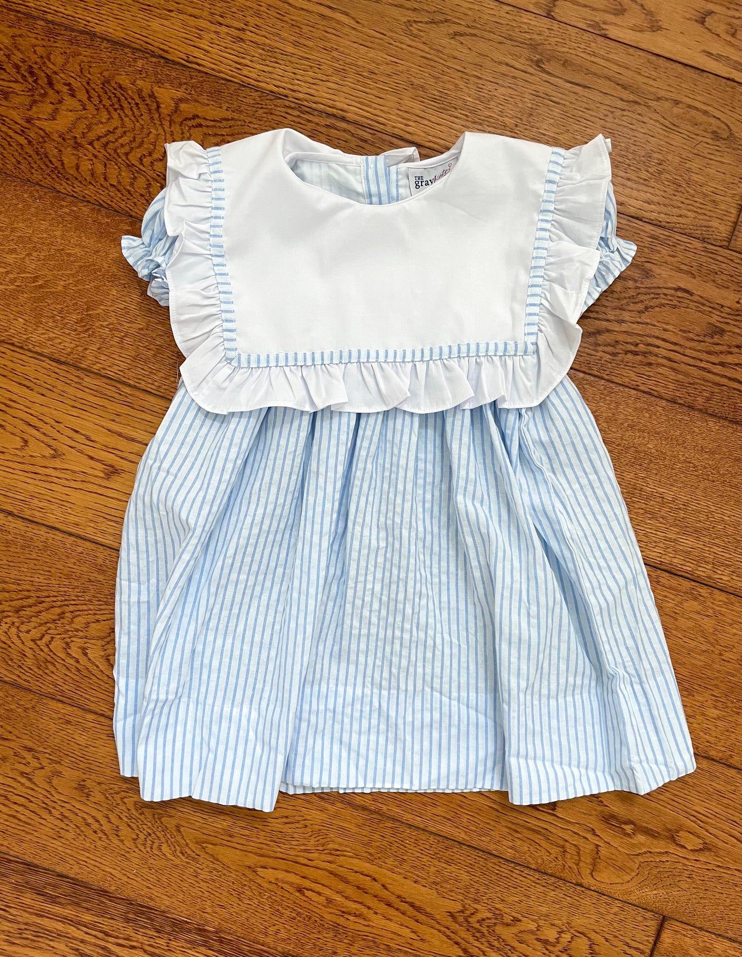 Riley ruffle dress in blue stripe